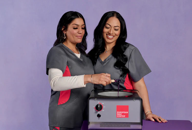 Two wax specialists with European Wax Center wax pot